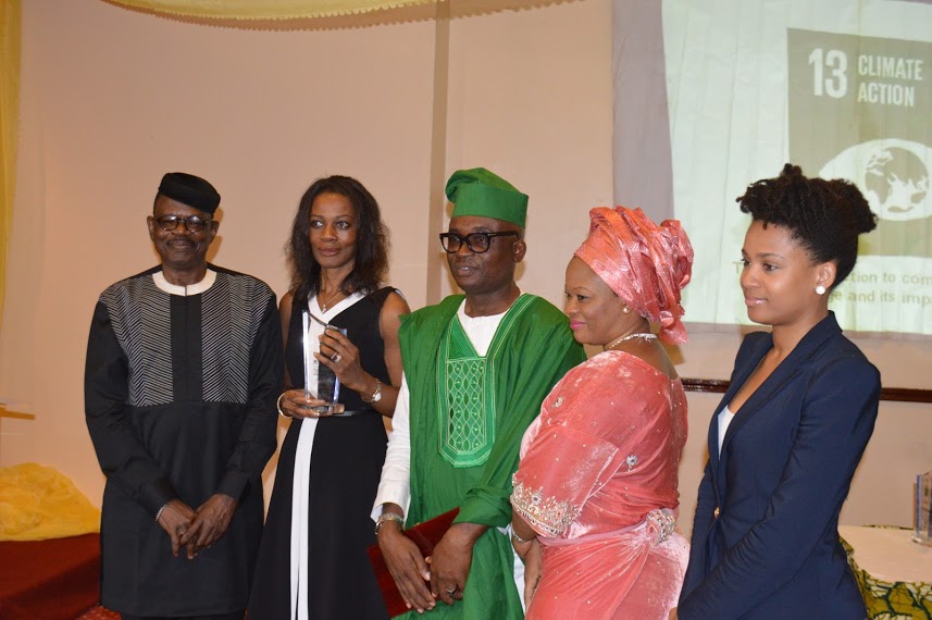 (l-r) Director, Marketing & Corporate Communications, UBA Africa, Bola Atta receiving the Millennium Development Goals (MDG) Award of year 2015 on behalf of Tony O. Elumelu from the Chairman of the event, Barrister Fred Agbaje (Esq), Barrister & Solicitor, Fred Agbaje’s Chamber’s (left); and CEO, Millennium Development Goals (MDG) Media Awards & Publisher, MDG Global Magazine, Prince Chuks Nwoko  at the 2015 MDG Media Awards in Lagos.