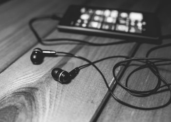 "desk-music-headphones-earphones" by pixellaphoto is marked with CC0 1.0